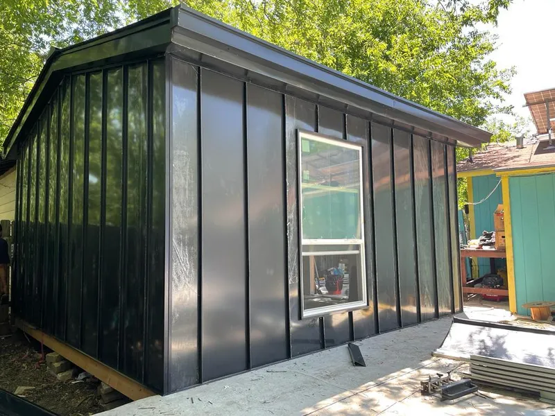 Black standing seam metal wall panels for Metal Roof Installation in Elsa