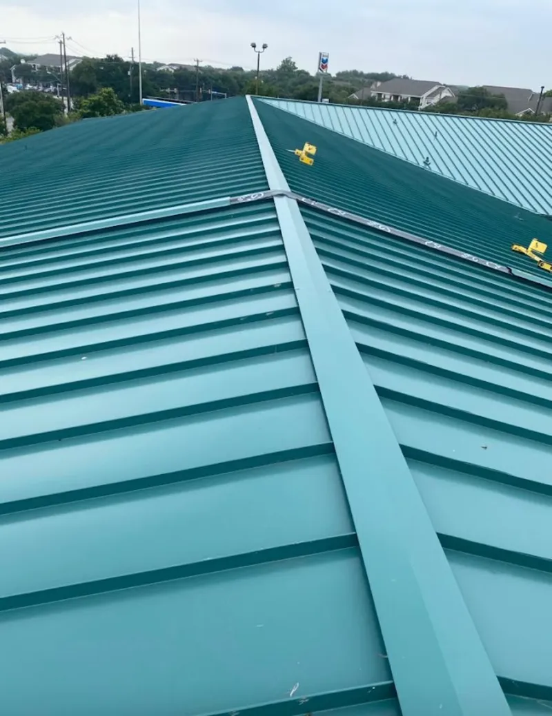 Green commercial metal roof ridge and valley for Metal Roof Repair in Elsa